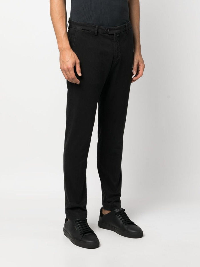 Black trousers with side and back pockets, in cotton and elastane 1